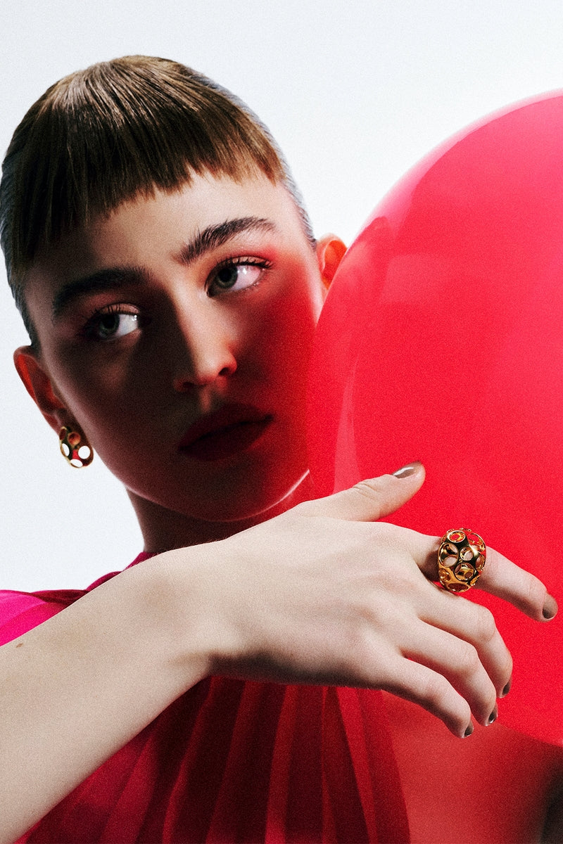 Maria Frering PONTOS GOLDEN HOOP EARRINGS featuring sleek, polished gold hoops on a white background.