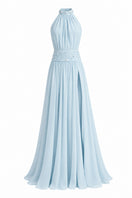 Powder blue embroidered gown by Monika Dimova featuring intricate embroidery and flowing fabric for elegant occasions.