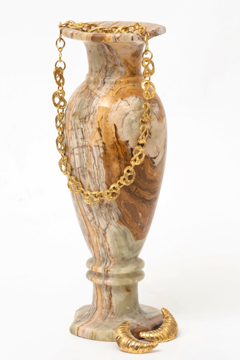 Gold pretzel-shaped mini chain necklace from Oz Objects, featuring a delicate and stylish jewelry design.