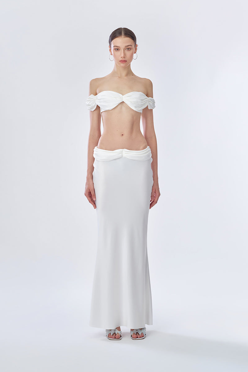 Off-white princess maxi skirt by Stolen Stores, flowing fabric with a flattering fit, styled with a casual top.