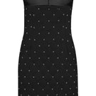 Nana Gotti Amal Dress mini dress with stylish design, shown in a vibrant, fashionable look on a model.