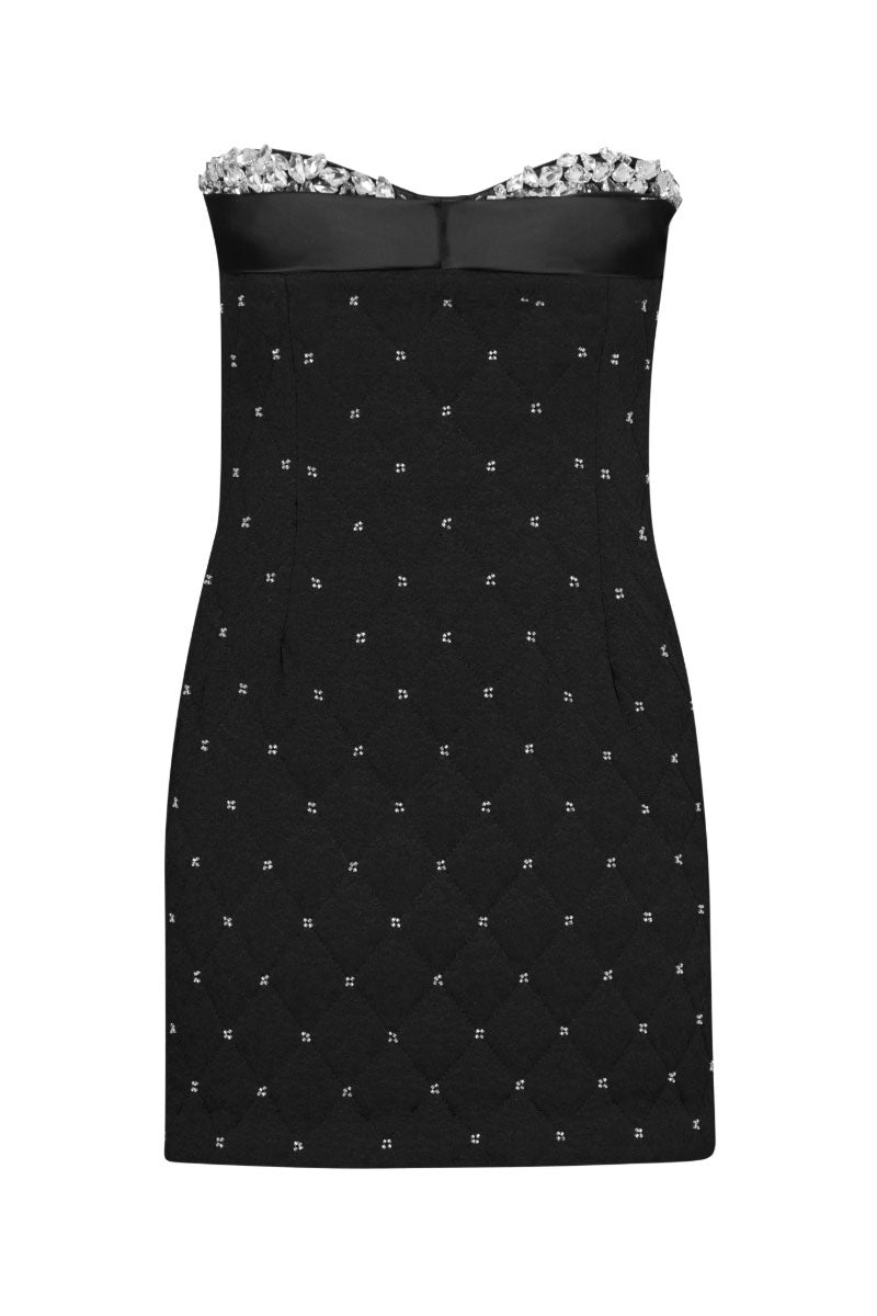 Nana Gotti Amal Dress mini dress with stylish design, shown in a vibrant, fashionable look on a model.