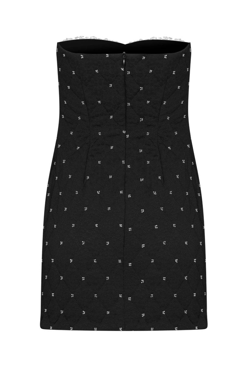 Nana Gotti Amal mini dress in vibrant fabric, featuring a fitted bodice and stylish skirt, photographed on a mannequin.