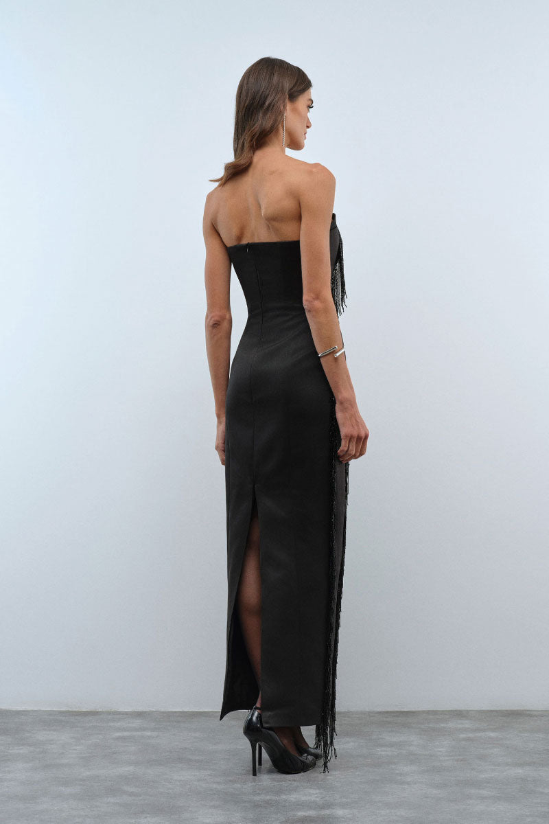 Nana Gotti Kristy Maxi Dress displayed on a hanger with flowing fabric and elegant design, perfect for casual or formal occasions.