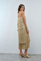 Nana Gotti HELIA Maxi Dress displayed on a hanger with flowing fabric and intricate design details.