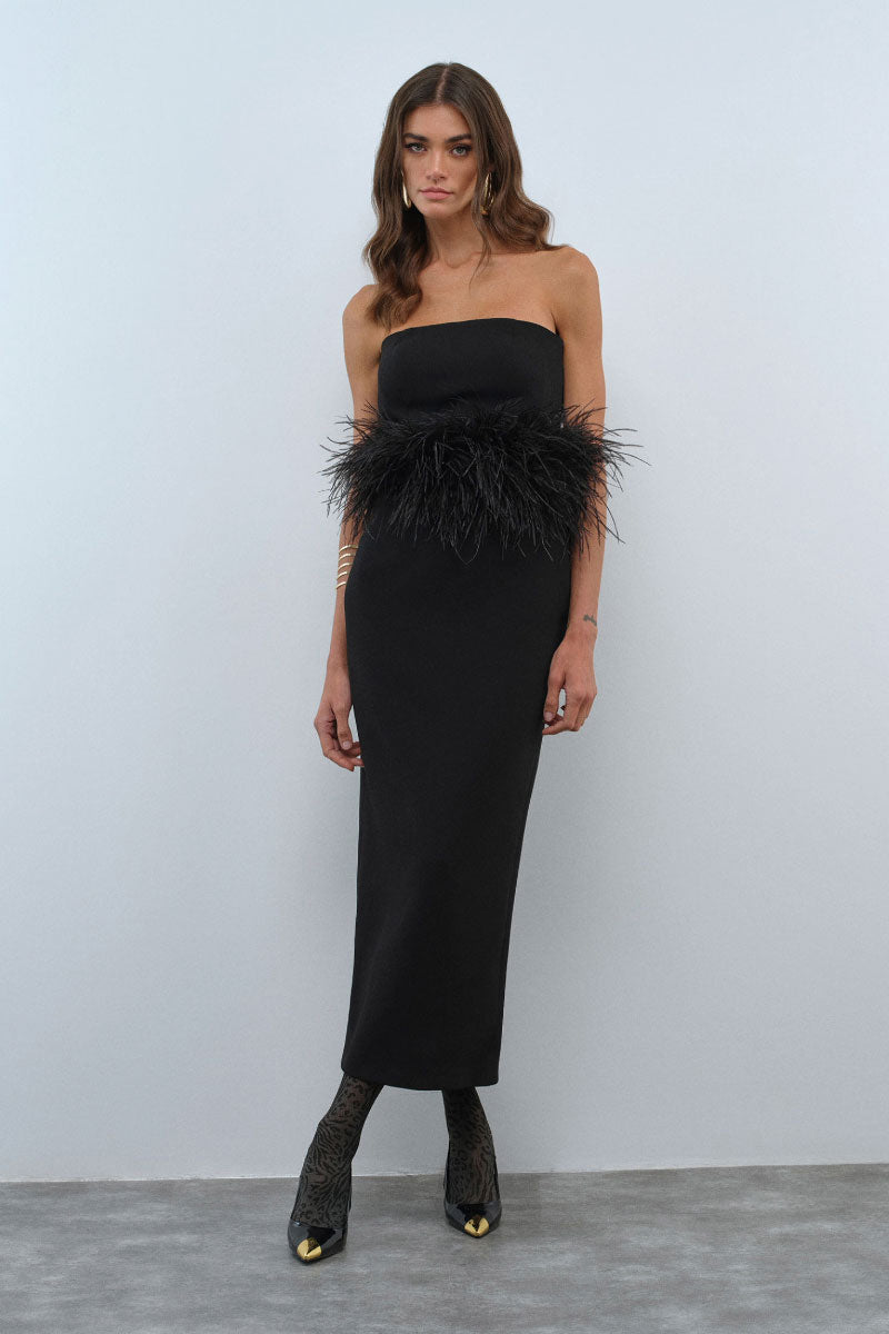 Nana Gotti VELA maxi dress featuring flowing fabric and elegant design, displayed on a hanger against a plain background.