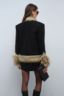 Nana Gotti Calla Blazer, stylish tailored jacket in neutral fabric, shown on a hanger with a clean background.