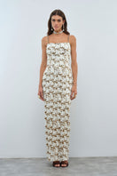 Nana Gotti Solana maxi dress featuring flowy fabric, sleeveless design, and a vibrant pattern perfect for summer wear.