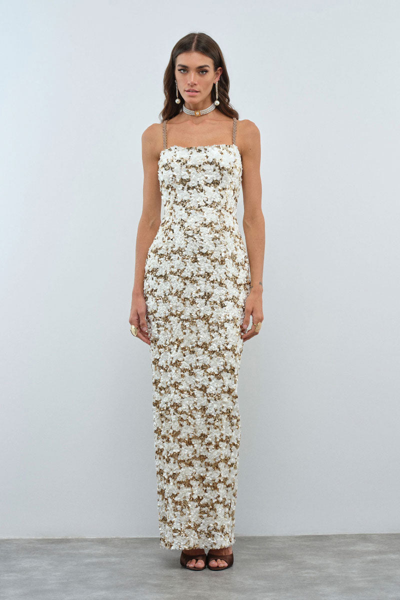 Nana Gotti Solana maxi dress featuring flowy fabric, sleeveless design, and a vibrant pattern perfect for summer wear.