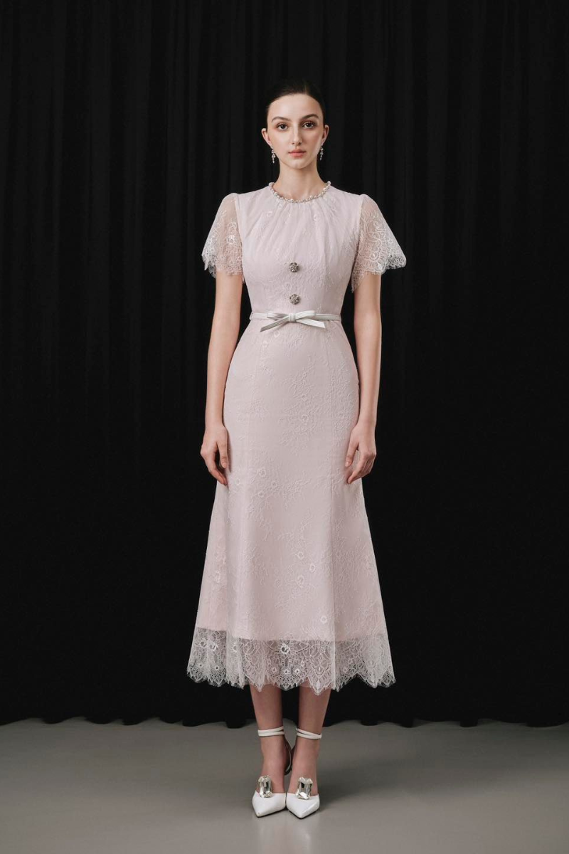 White Plan Prucel midi dress featuring a flowing silhouette and elegant design, perfect for stylish occasions.