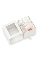 Pair of puff hair scrunchies in pink and white from MANITO, soft fabric hair accessories for styling or securing hair.