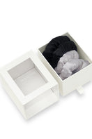 Pair of MANITO puff hair scrunchies in gray and black with soft, fluffy texture, perfect for casual or stylish hair accessories.