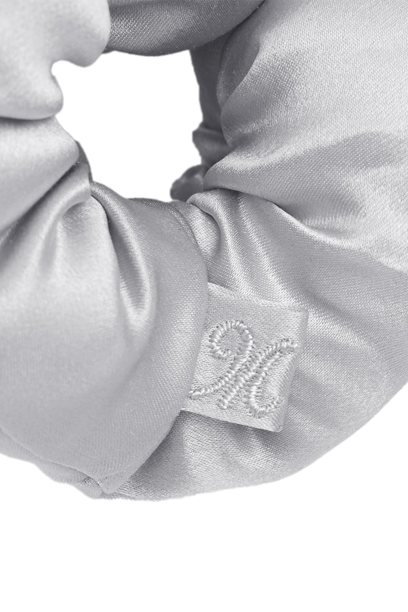 Set of puff hair scrunchies in gray, black, pink, and white by MANITO, featuring soft, textured fabric for stylish hair accessories.