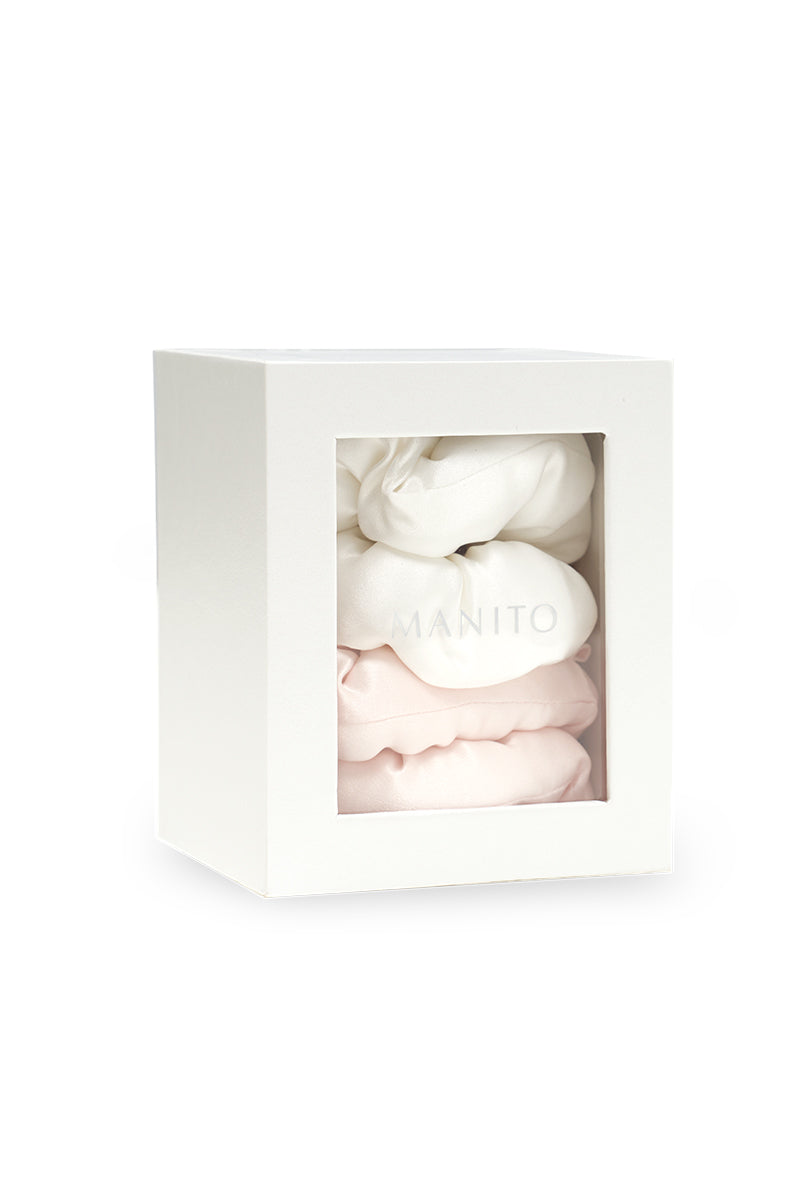 Pair of pink and white puff hair scrunchies by MANITO, soft fabric hair accessories for casual or stylish hair styling.