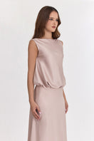Silver pink puffed boatneck maxi gown by Stolen Stores displayed on a model, showcasing its elegant flowing design and feminine style.