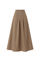 Camel-colored ANA + MARIA Pura midi skirt displayed on a model, showcasing its elegant flow and stylish design.