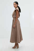 Camel midi skirt by ANA + MARIA featuring a flowy silhouette and stylish design.