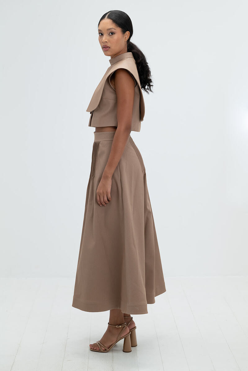 Camel midi skirt by ANA + MARIA featuring a flowy silhouette and stylish design.