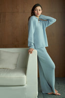 Blue Purity women's polo knit top by MANITO, featuring a classic sweater style with a collared neckline and lightweight fabric.