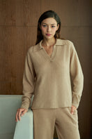 Beige MANITO Purity women's straight leg knit pants displayed on a model, showcasing comfortable fit and stylish design.