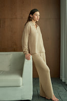 Manito Purity women's beige straight leg knit pants displayed on a model, showcasing a comfortable, casual pant style.