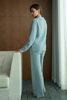 Manito Purity women's straight leg knit pants in blue, showing a close-up of the fabric and fit on a model.