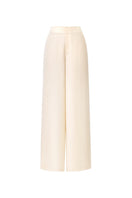 Montsand ivory wide-leg trousers shown on a model, featuring a relaxed fit and high waist for a stylish, comfortable look.