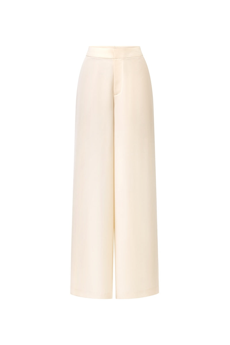 Montsand ivory wide-leg trousers shown on a model, featuring a relaxed fit and high waist for a stylish, comfortable look.