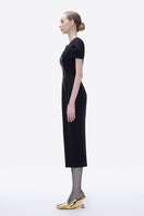 Hand-painted black Blossom Noir midi dress by Tiny Ink, featuring elegant design and flowing fabric, perfect for stylish occasions.