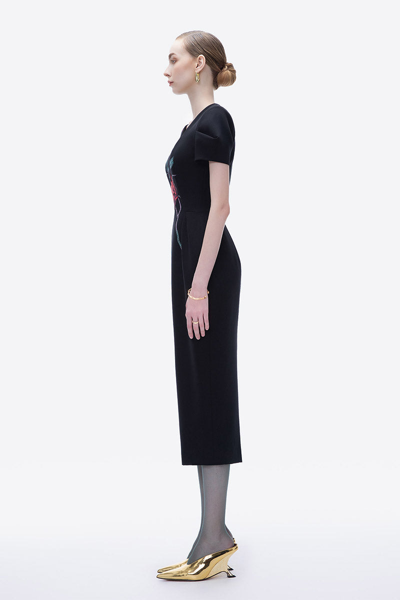 Hand-painted black Blossom Noir midi dress by Tiny Ink, featuring elegant design and flowing fabric, perfect for stylish occasions.