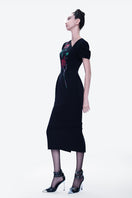 Hand-painted black Blossom Noir midi dress by Tiny Ink, featuring elegant floral design and flowing fabric for a stylish look.