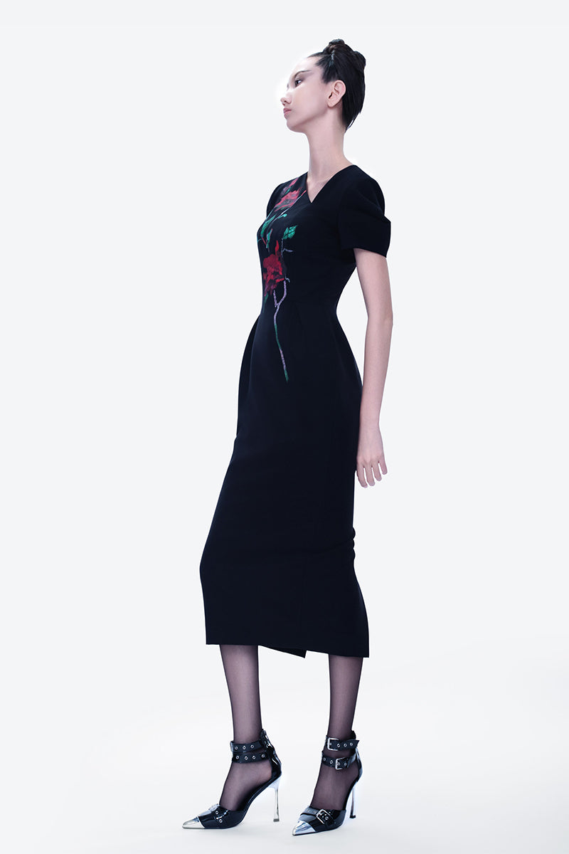 Hand-painted black Blossom Noir midi dress by Tiny Ink, featuring elegant floral design and flowing fabric for a stylish look.