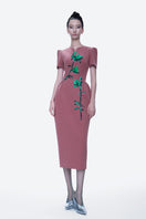 Tiny Ink Mystic Elegance midi dress in hand-painted pink fabric, featuring a stylish, flowing design perfect for elegant occasions.