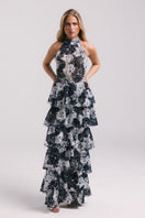 Francisco Arce KEI gown with elegant design, flowing fabric, and intricate details, perfect for formal occasions.