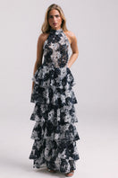 Elegant KEI dress gown by Francisco Arce featuring intricate embroidery and flowing fabric, perfect for formal occasions.