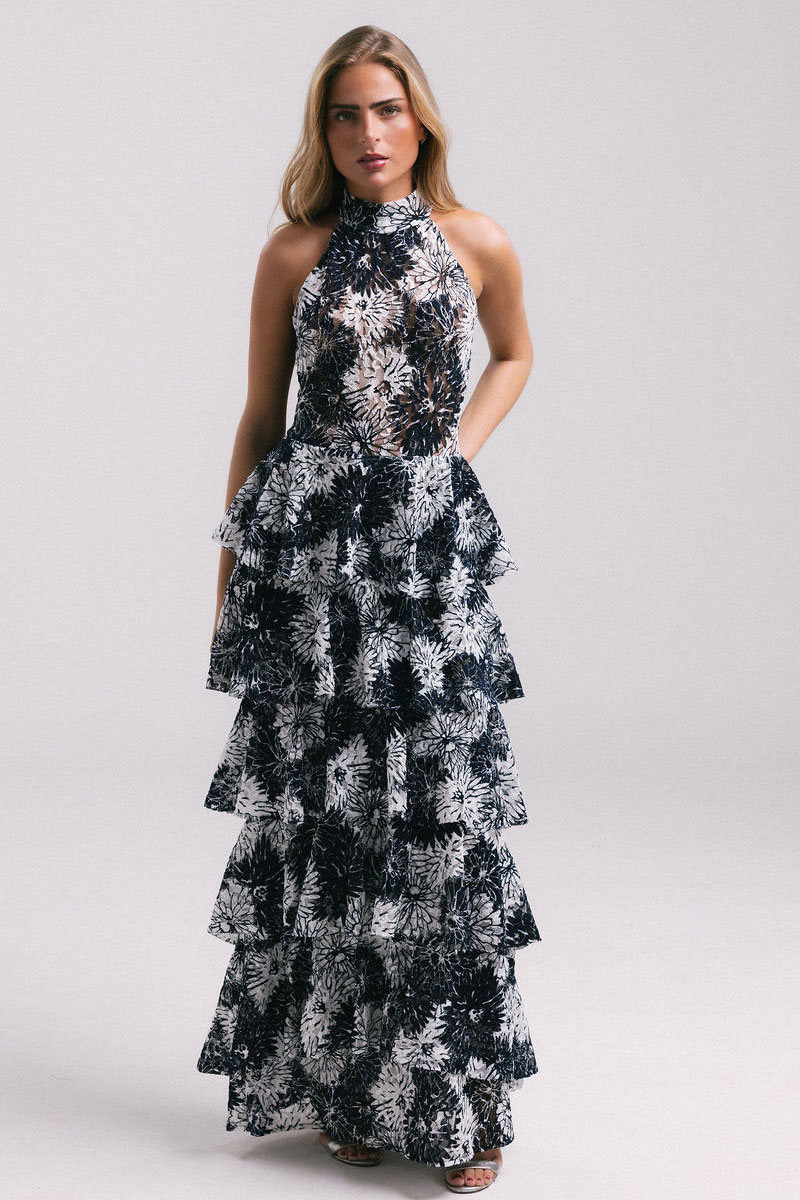 Elegant KEI dress gown by Francisco Arce featuring intricate embroidery and flowing fabric, perfect for formal occasions.