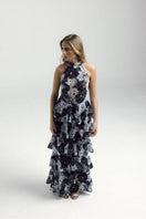 Francisco Arce KEI gown with elegant design, flowing fabric, and intricate detailing, perfect for formal occasions.