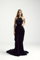 Francisco Arce black gown from the VEYA dress collection, elegant evening dress with flowing fabric and sophisticated design.