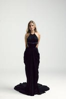 Black VEYA gown by Francisco Arce, elegant long dress with flowing fabric and sophisticated design, perfect for formal occasions.