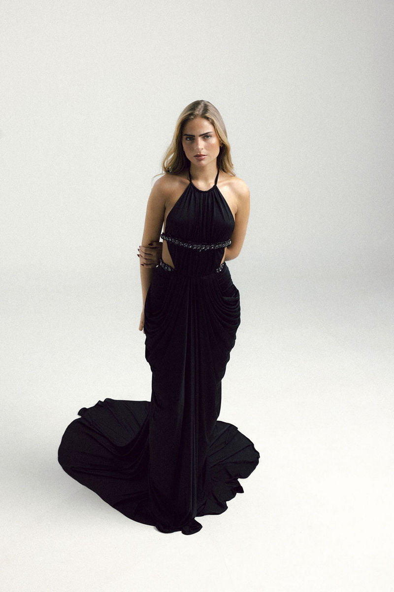 Black VEYA gown by Francisco Arce, elegant floor-length dress with a sleek silhouette and stylish design.