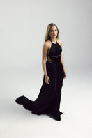 Elegant black gown by Francisco Arce featuring a flowing design, perfect for formal occasions.
