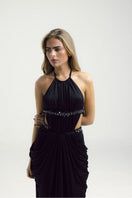 Elegant black gown by Francisco Arce featuring a flowing silhouette and sophisticated design, perfect for formal occasions.
