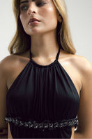 Black VEYA gown by Francisco Arce featuring elegant fabric and a flowing silhouette, perfect for formal occasions.