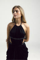 Black VEYA gown by Francisco Arce, featuring elegant design with flowing fabric and stylish silhouette, perfect for formal occasions.