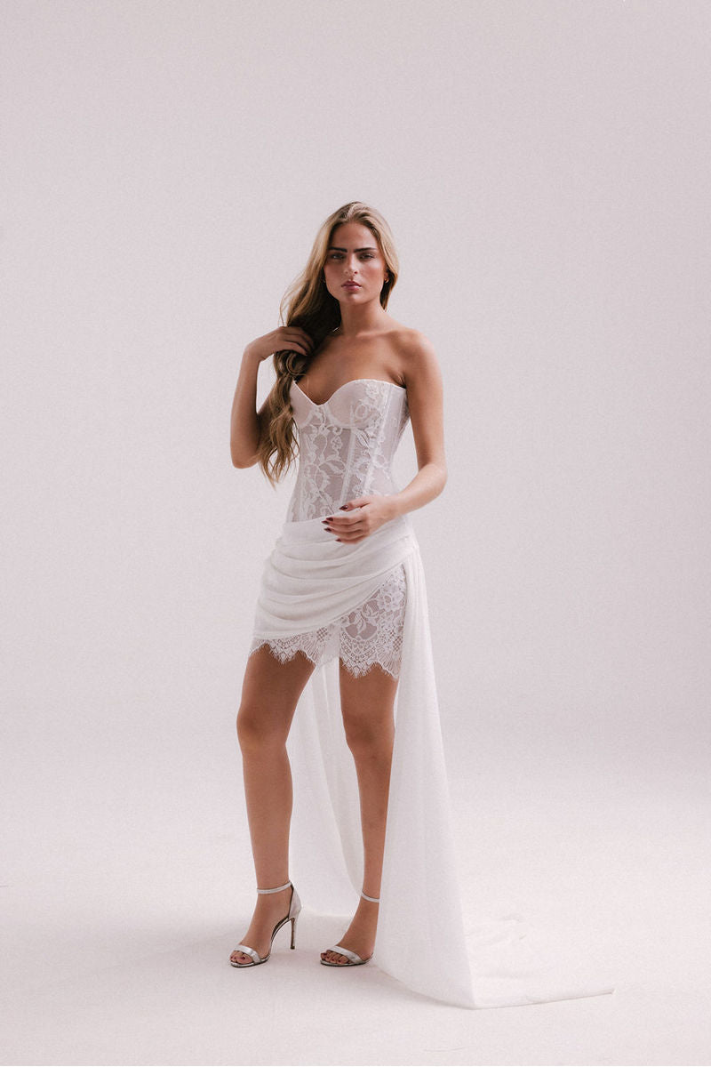 Francisco Arce LUMI mini dress in vibrant fabric, fitted silhouette with stylish neckline, perfect for casual or evening wear.