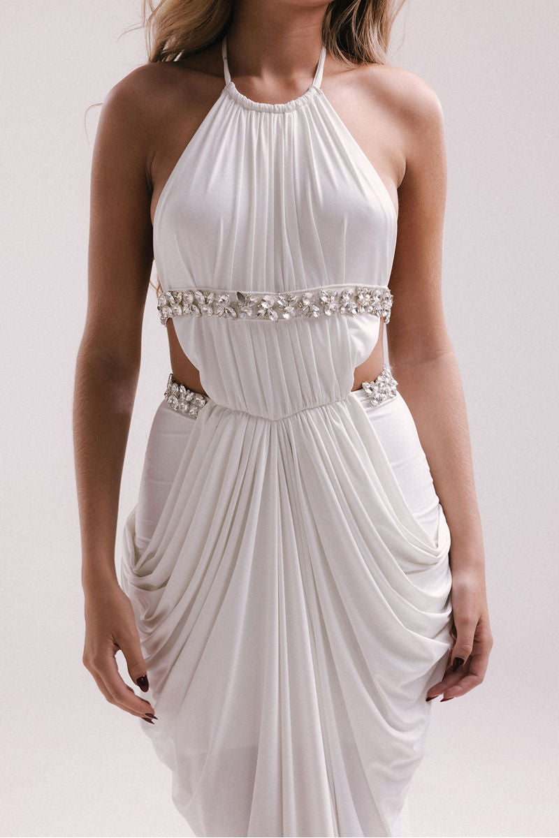 Elegant white VEYA gown by Francisco Arce, featuring flowing fabric and sophisticated design, perfect for formal occasions.