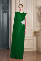 Green column gown with an attached one-shoulder long cape by I.H.F, featuring a sleek silhouette and elegant drape.
