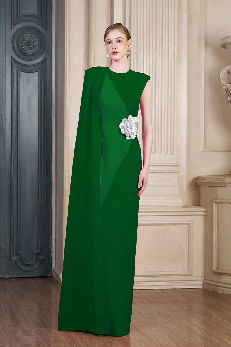 Green column gown with an attached one-shoulder long cape by I.H.F, featuring a sleek silhouette and elegant drape.