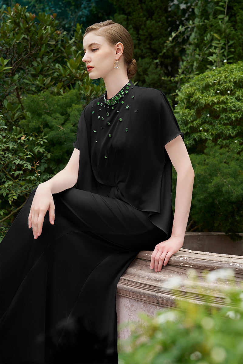 Black mermaid gown with high neck and gathered waist by I.H.F, featuring a fitted silhouette and elegant design.