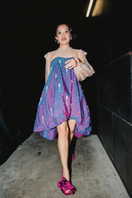 Christin Wu Raina Fuchsia Bow Heels, stylish pink heels with bow detail, displayed on a model's feet in a lifestyle setting.